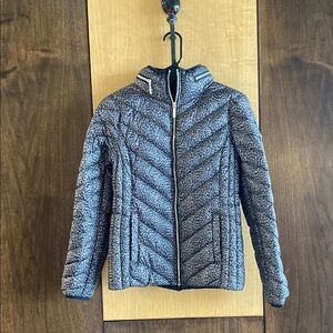 Women's small animal print packable down fill  Jacket with hidden hood.